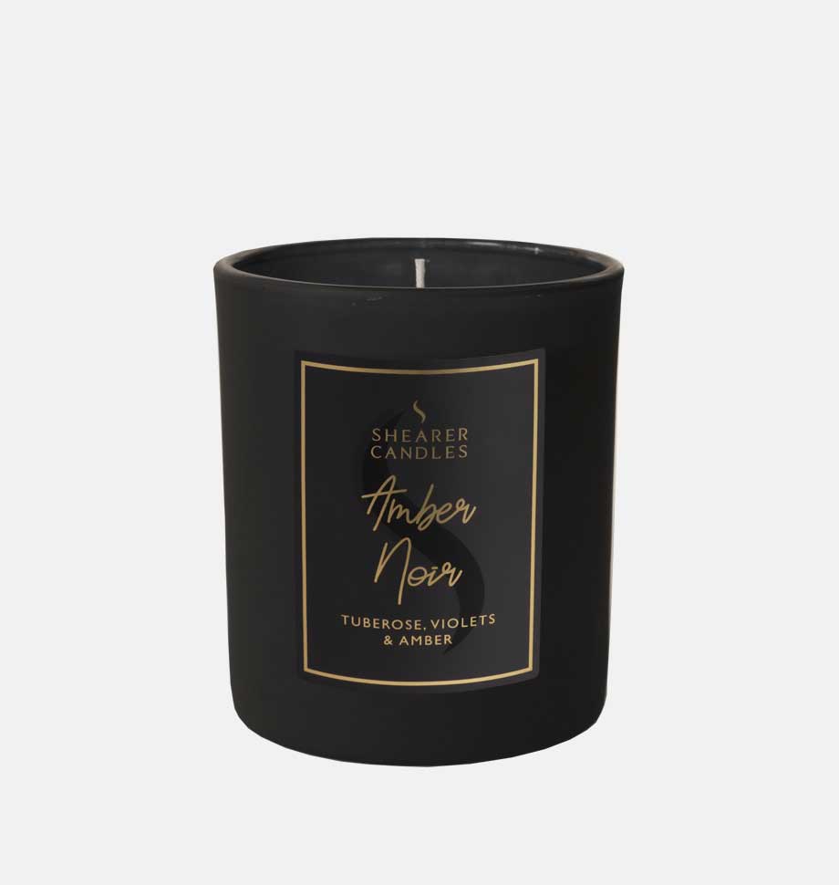 black candle in jar